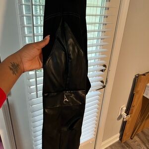 Black Leather jumpsuit with Logo Detail